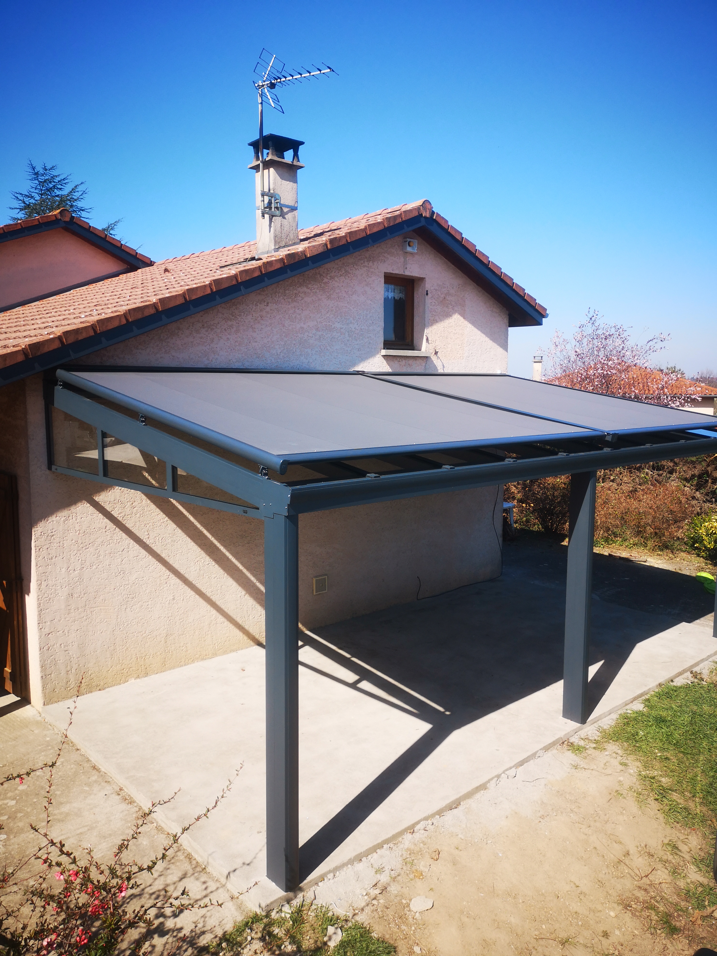 Pergola en oasis de verre avec store banne intégré